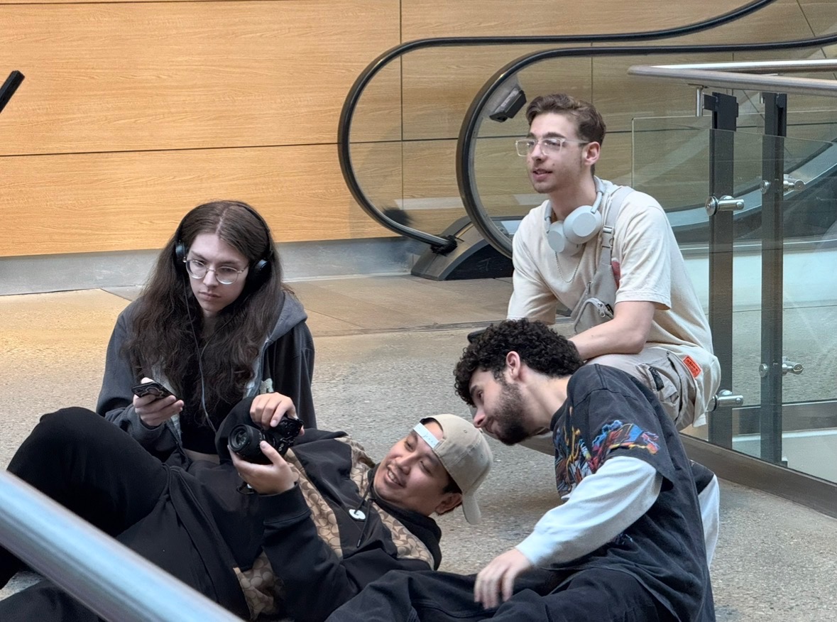 Costa and crew reviewing camera footage behind the scenes